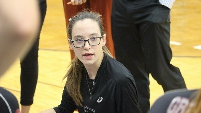Julie Street coaching athletes during timeout