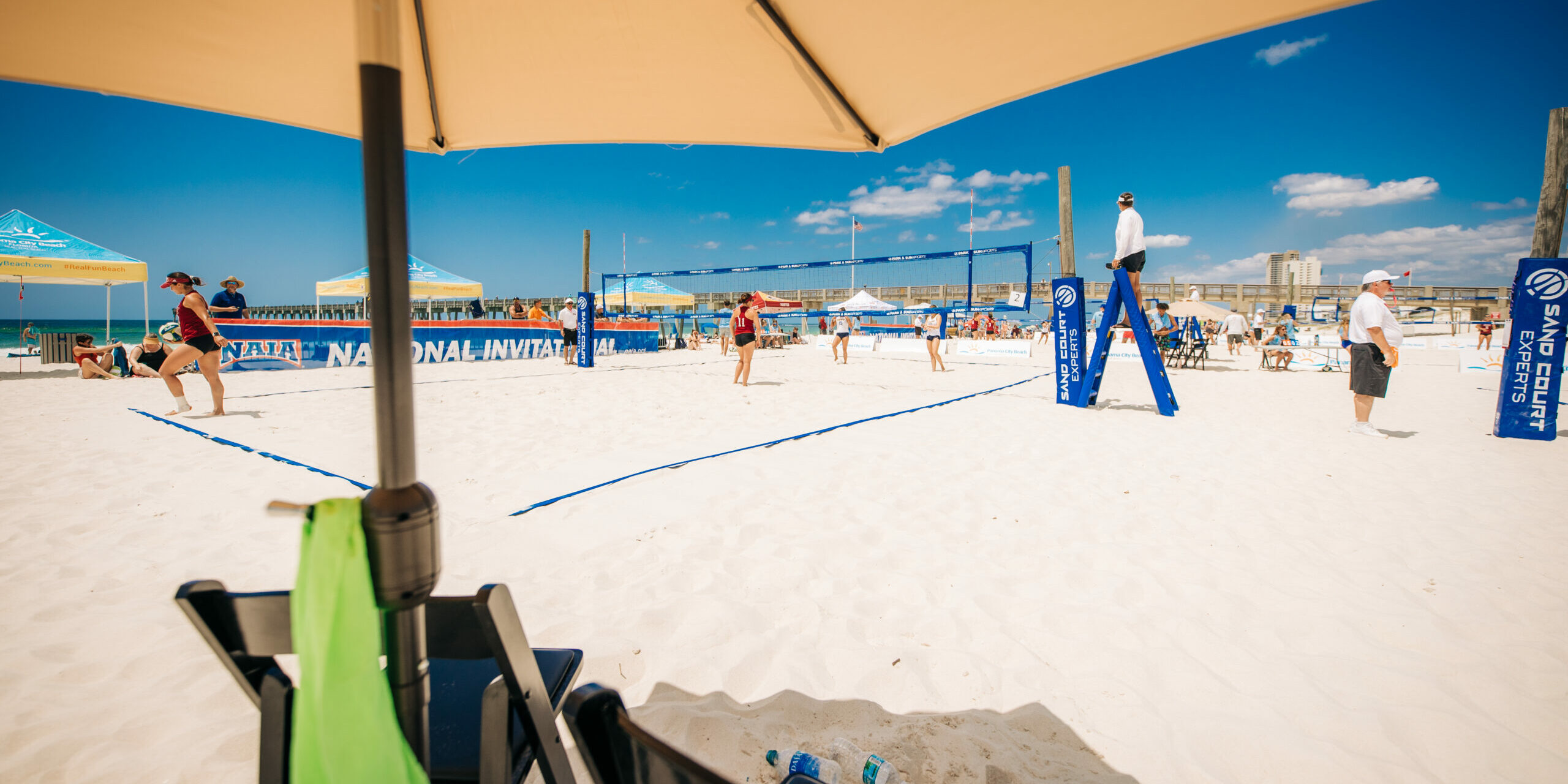 Beach volleyball court and umbrella