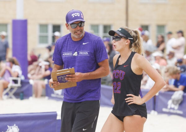 Hector Gutierrez speaking with one of his TCU beach athletes