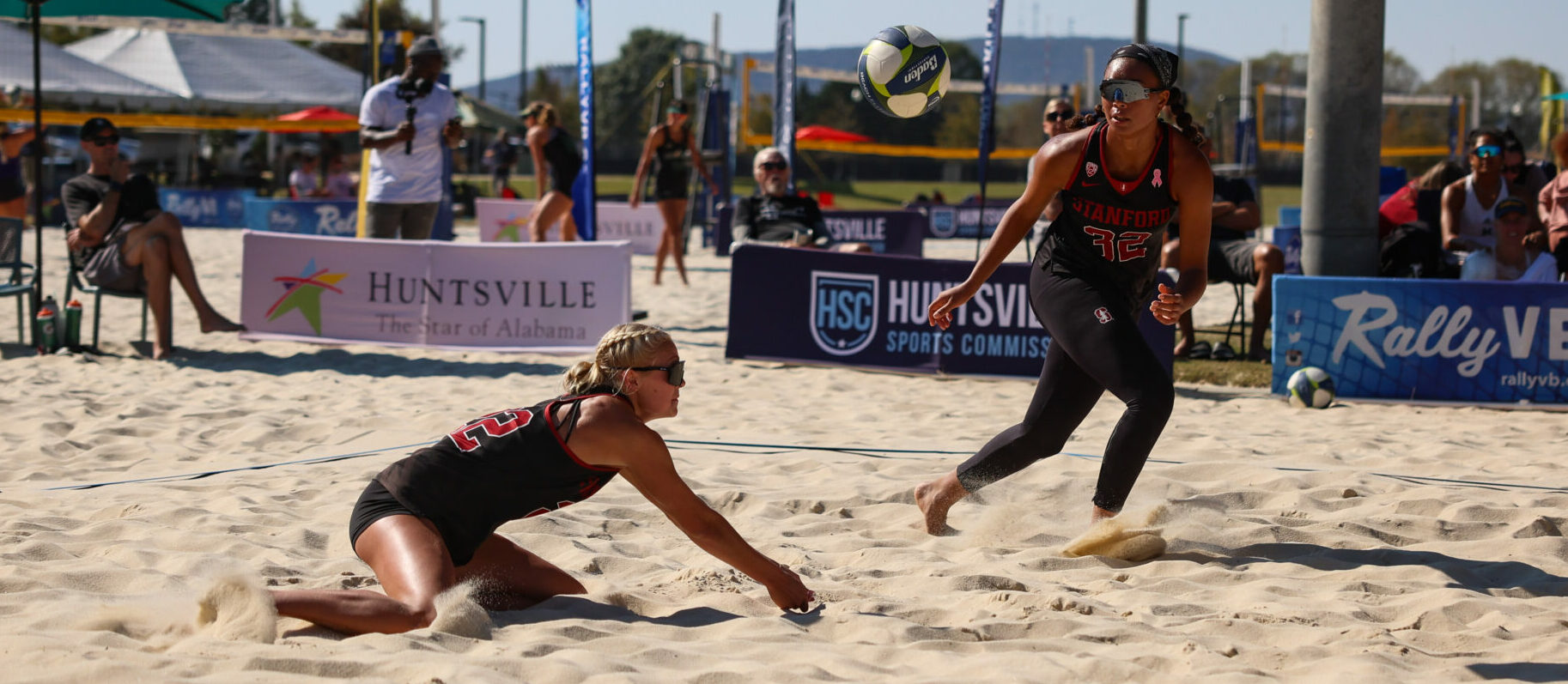 Stanford beach volleyball player passing a ball
