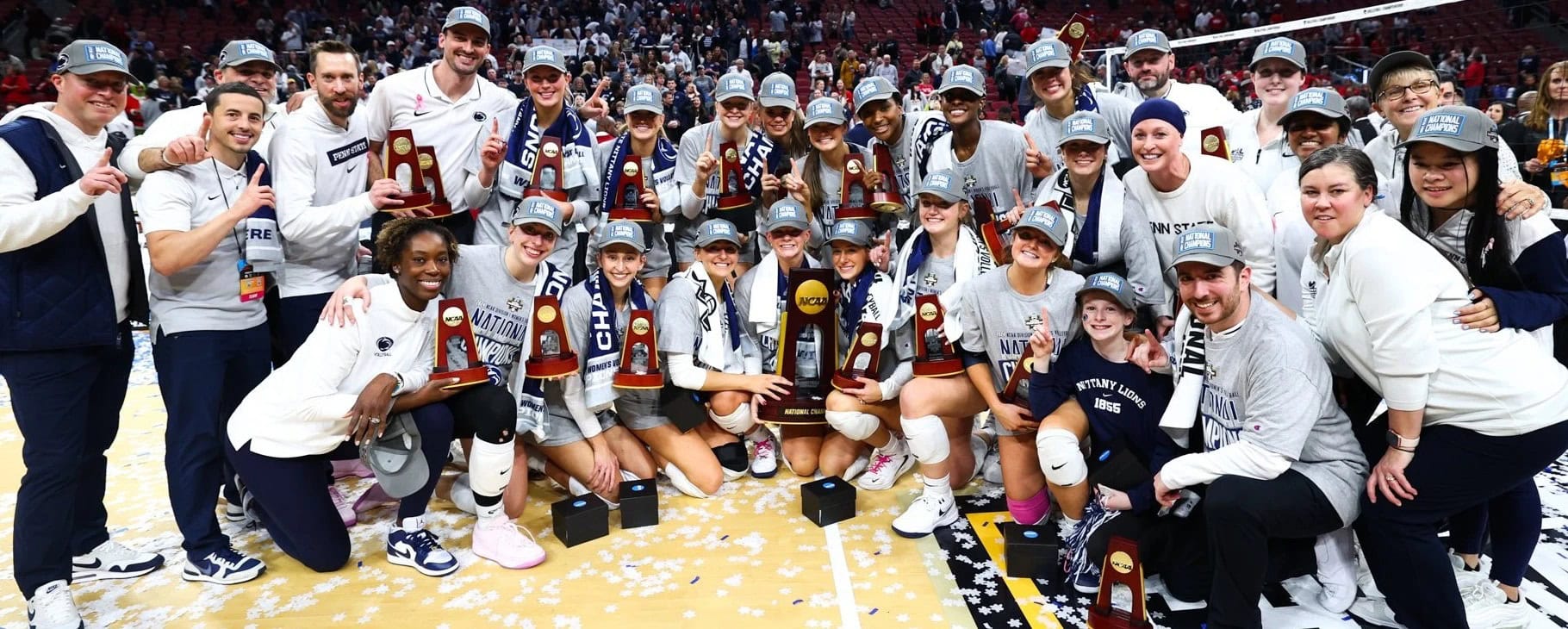 Penn State Volleyball posing with their national championship trophy