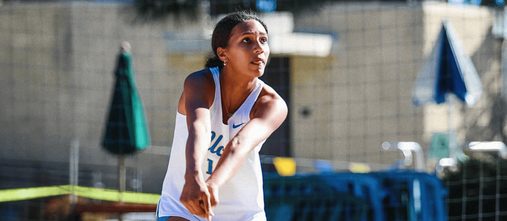UCLA beach volleyball player passing