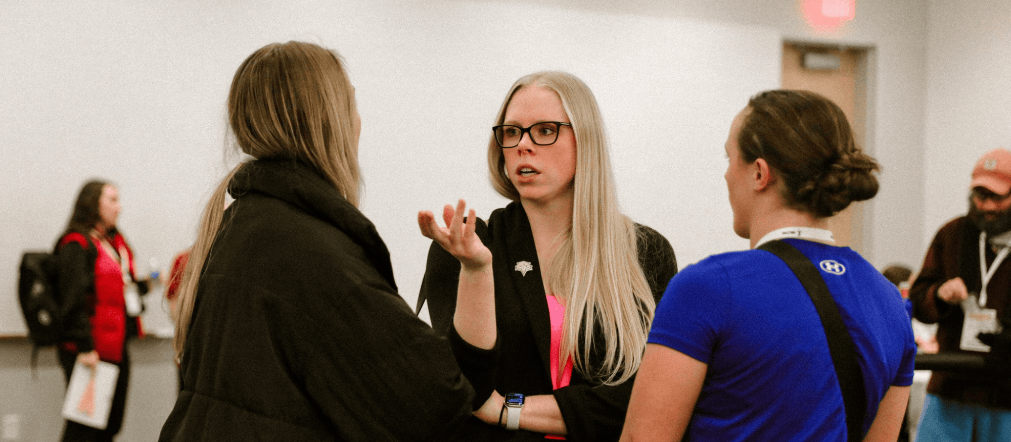 Three Volleyball Coaches having a conversation