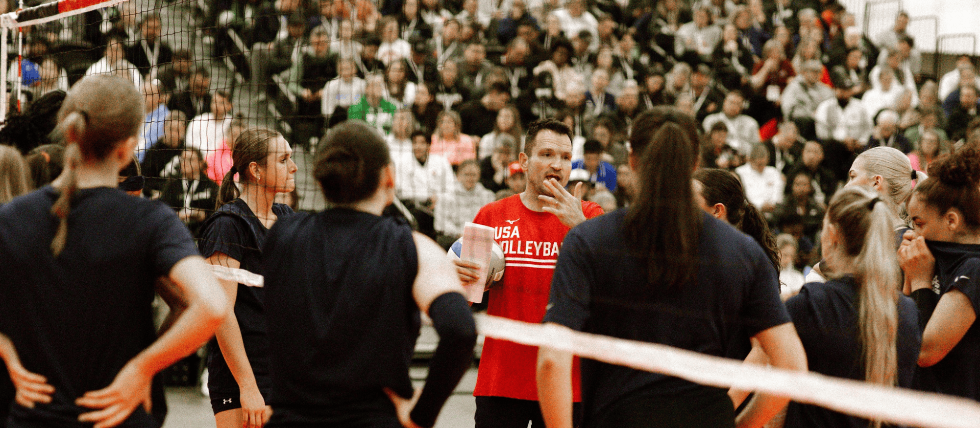 Luka Slabe talking to athletes while presenting at the AVCA Convention