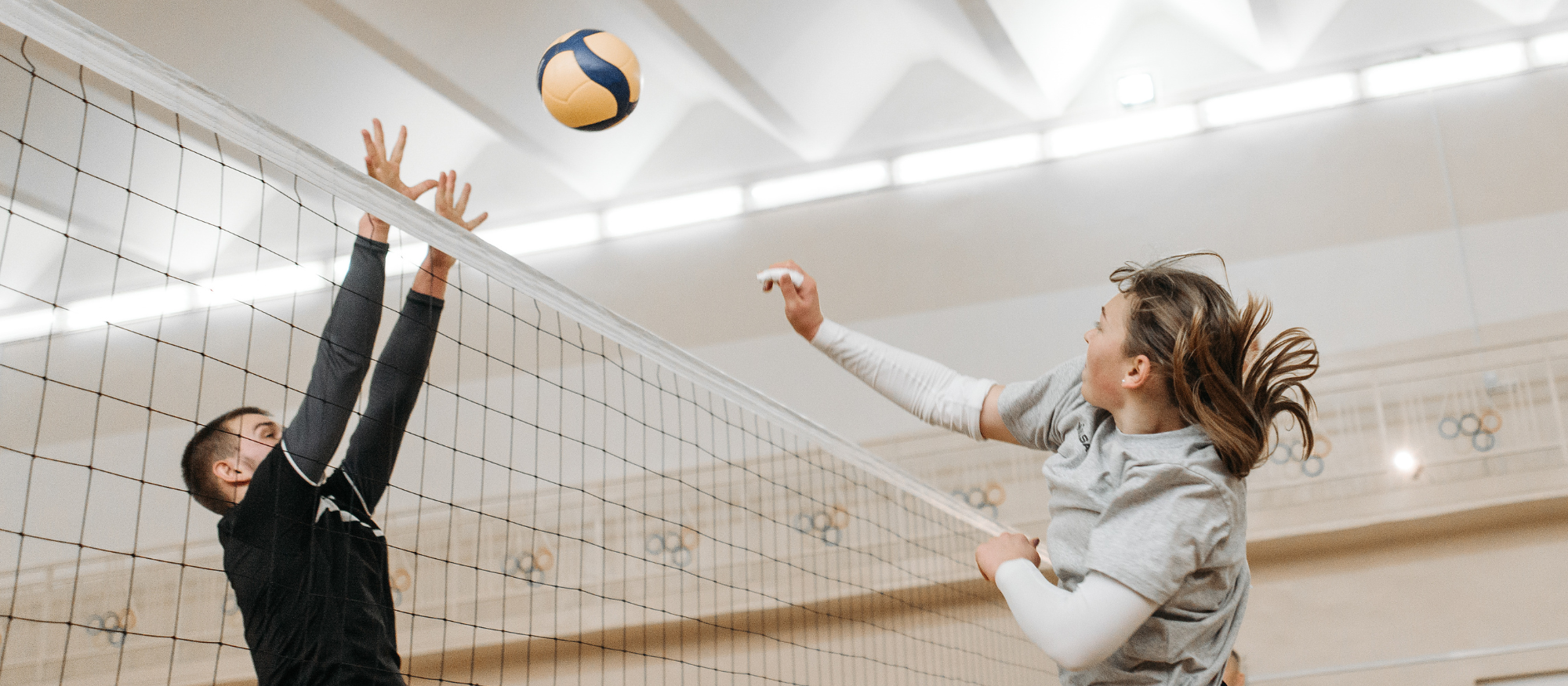 Canva generated photo of a man and woman playing vb