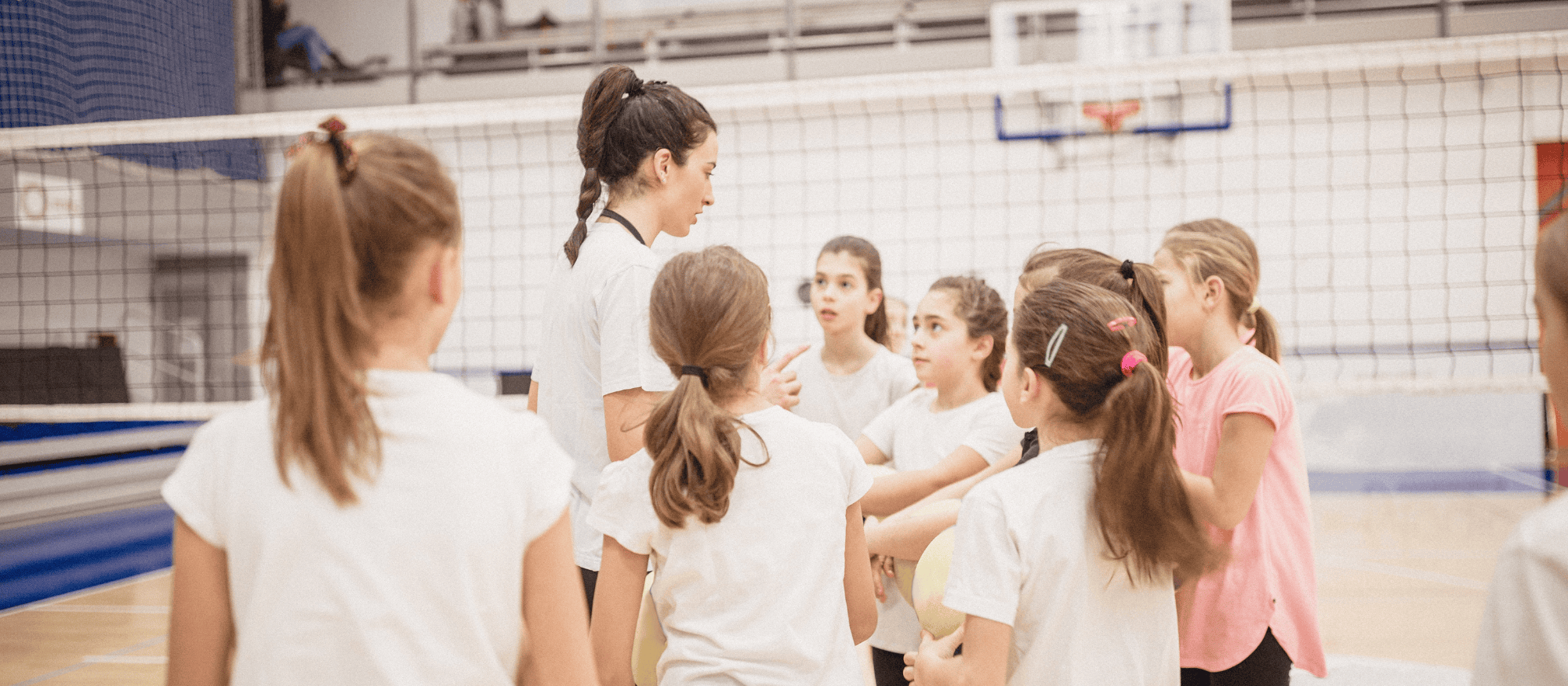 Canva generated photo of volleyball coach and players
