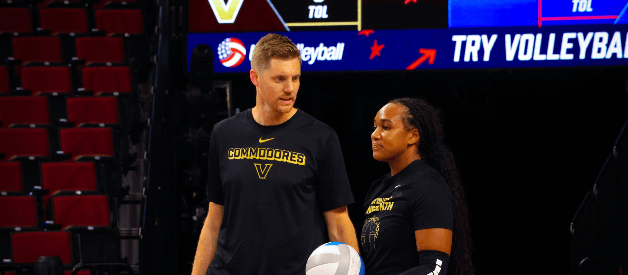volleyball coach talking with athlete