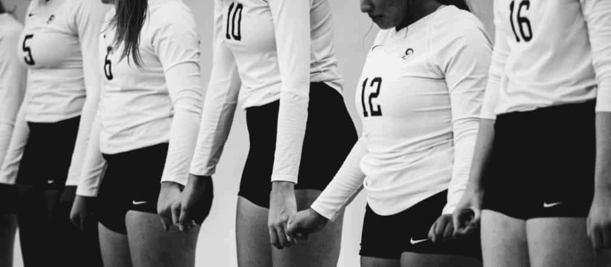 Volleyball players holding hands
