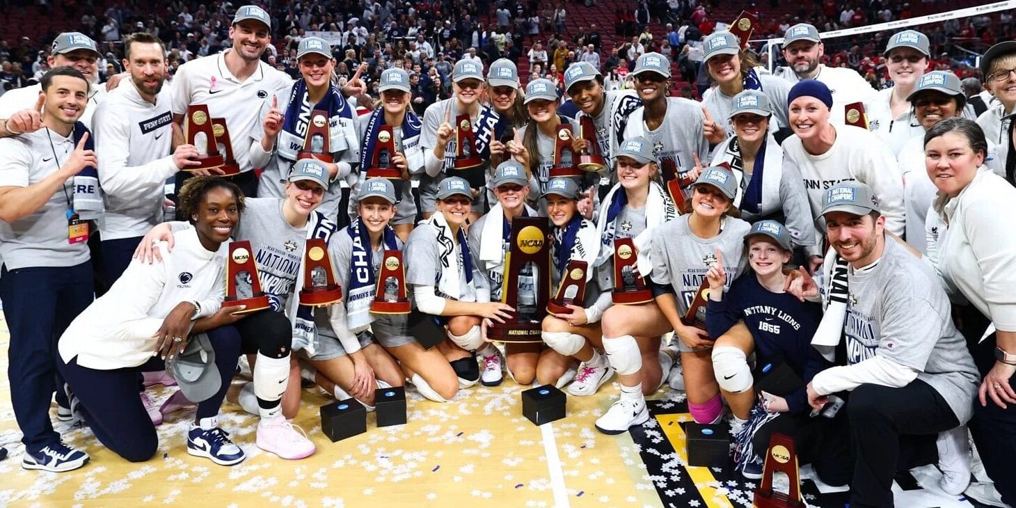 Penn State Volleyball posing with their national championship trophy