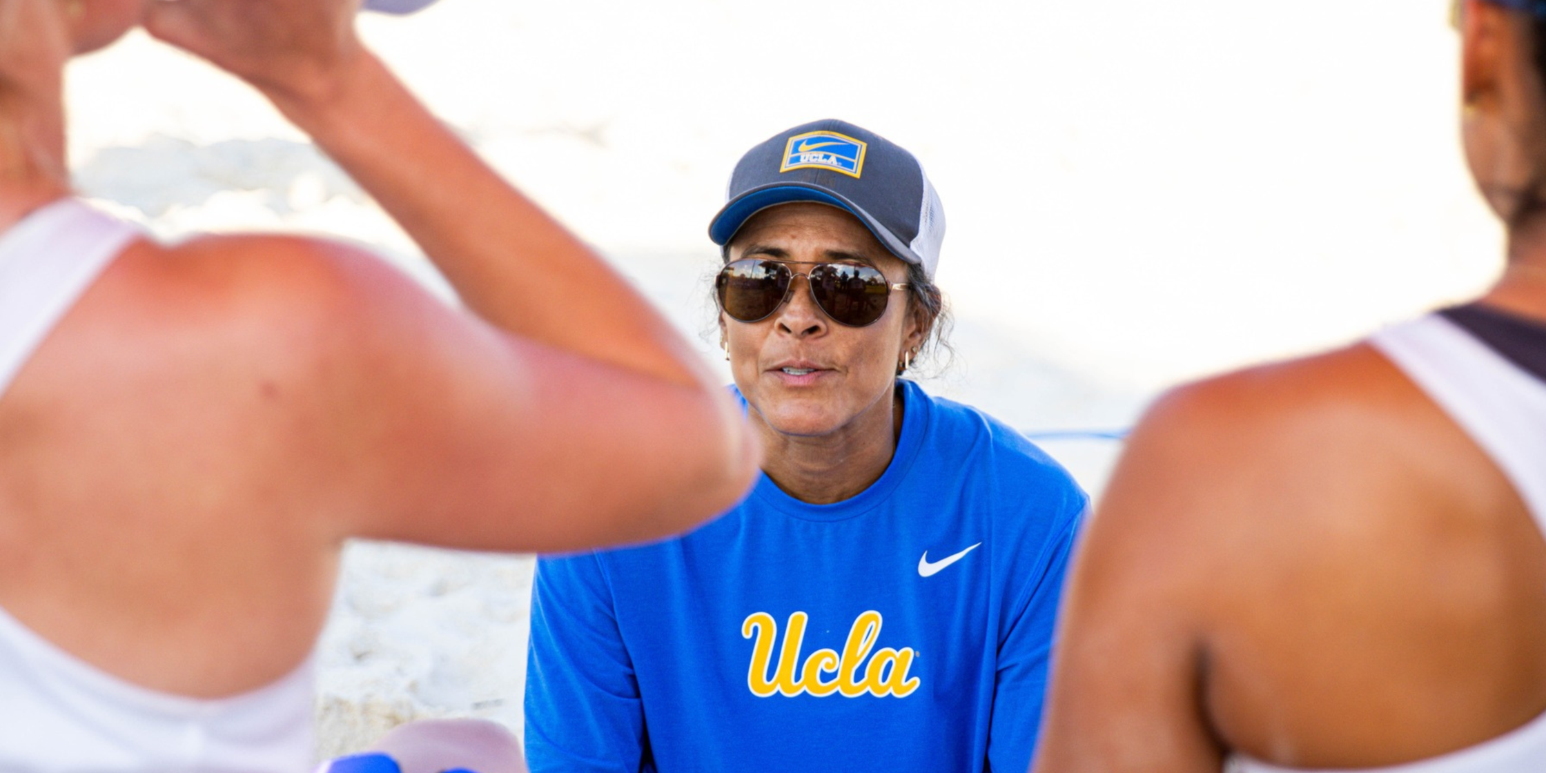 Jenny Johnson Jordan talking to beach volleyball athletes