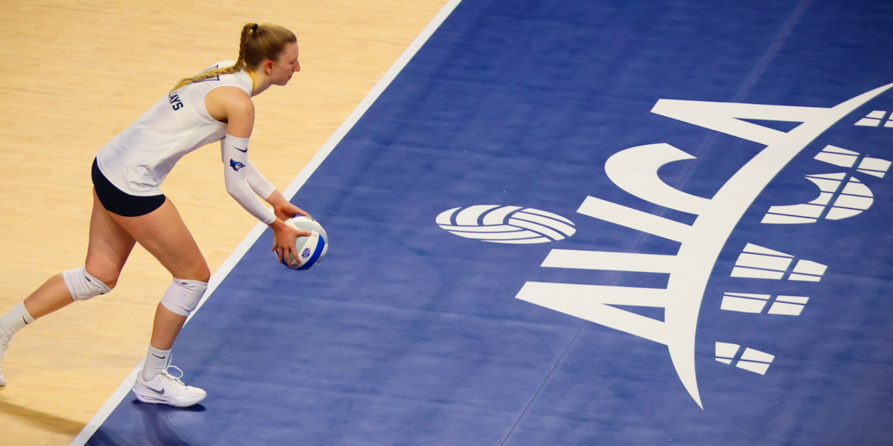 Athlete serving on an AVCA Taraflex court at 2025 AVCA First Serve