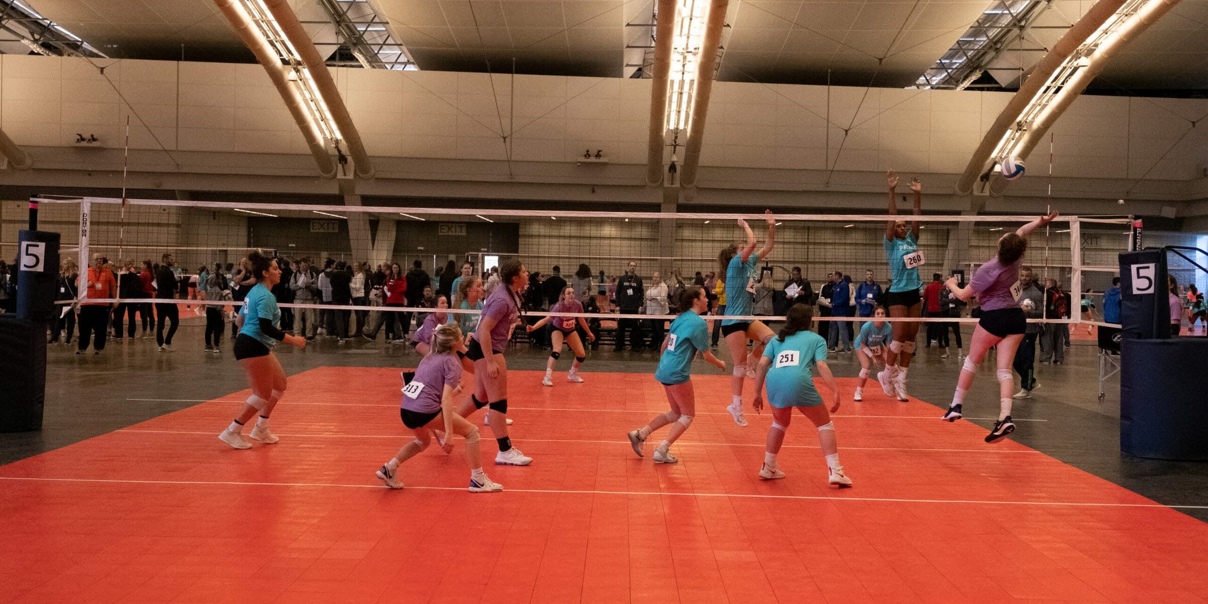 Athletes participating at Phenom while college coaches watch