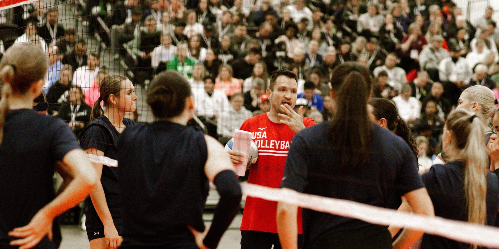 Luka Slabe talking to athletes while presenting at the AVCA Convention