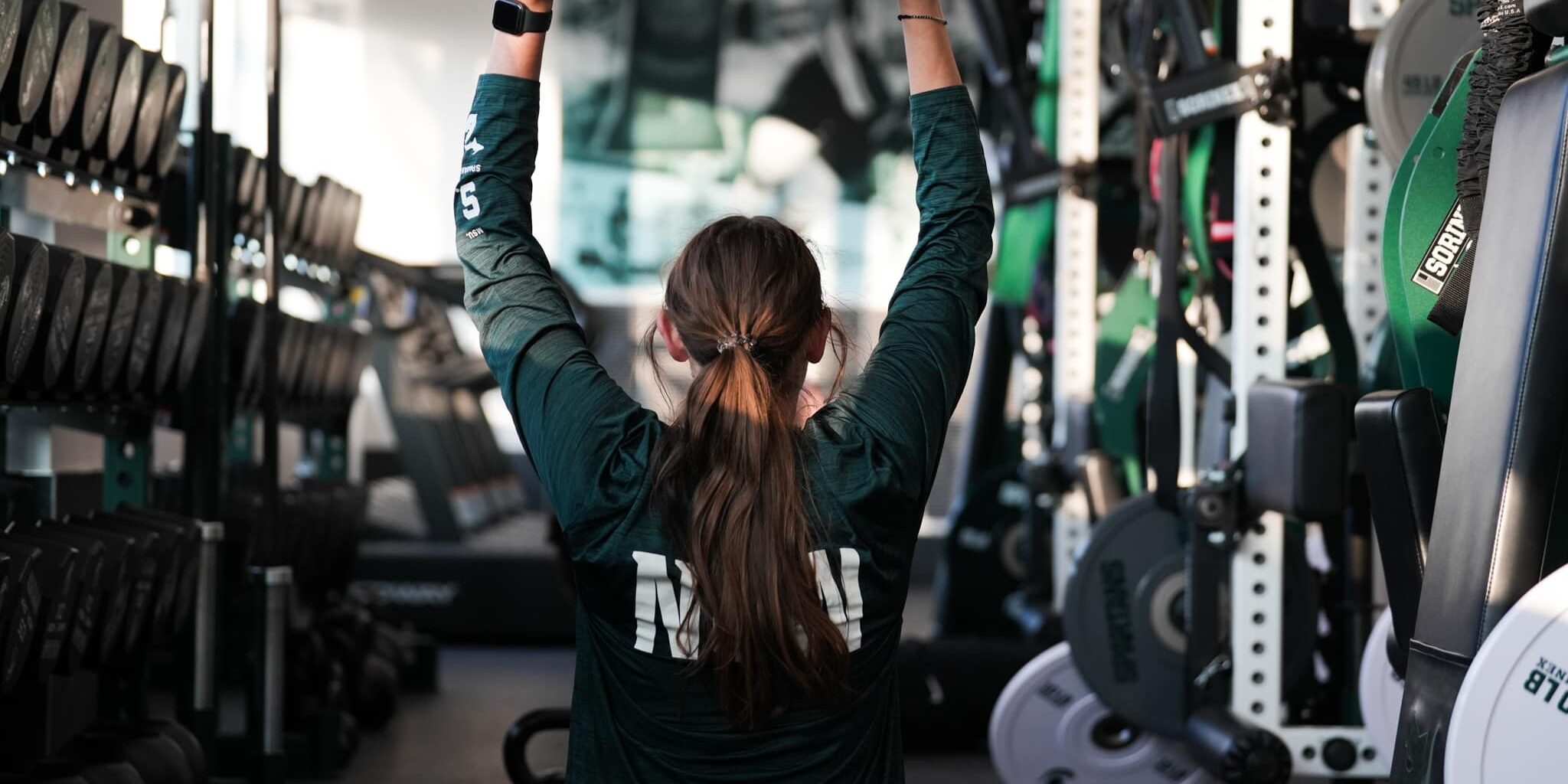 women's volleyball player doing weight training