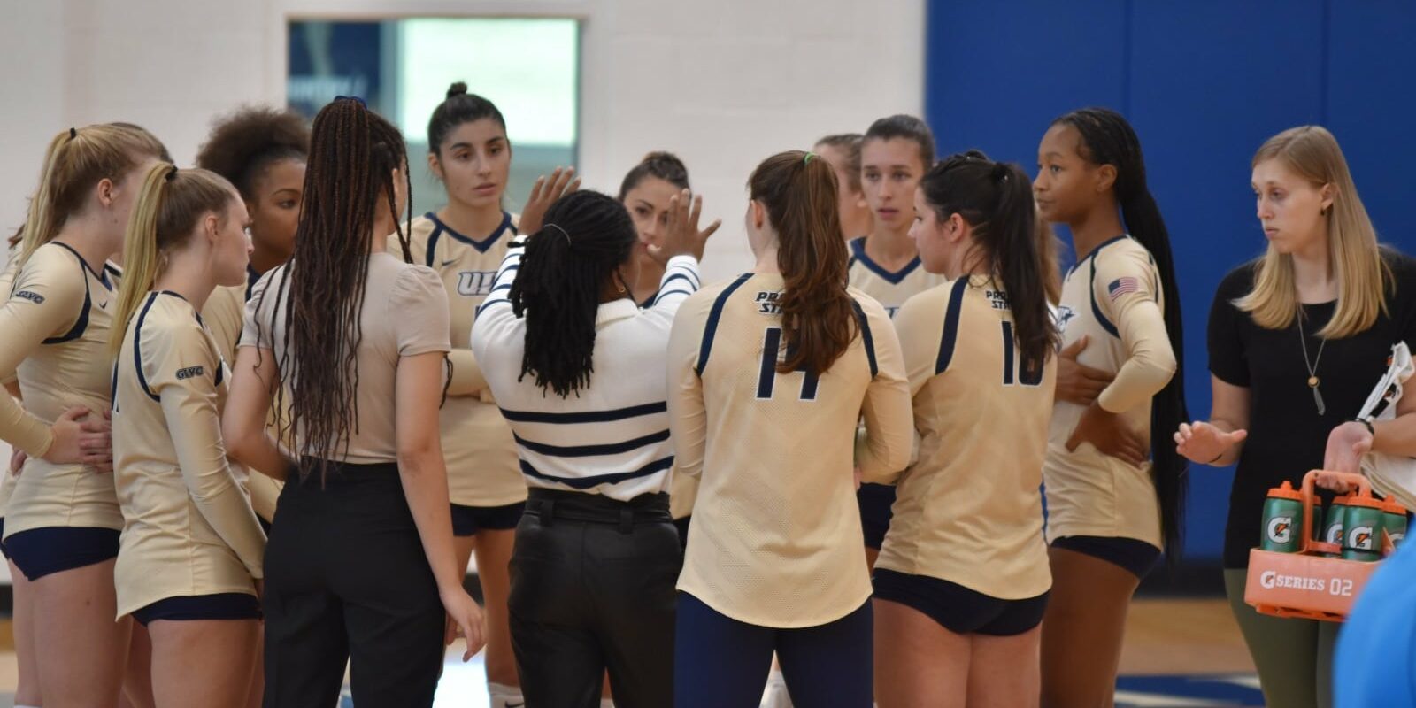 Women's volleyball team huddle