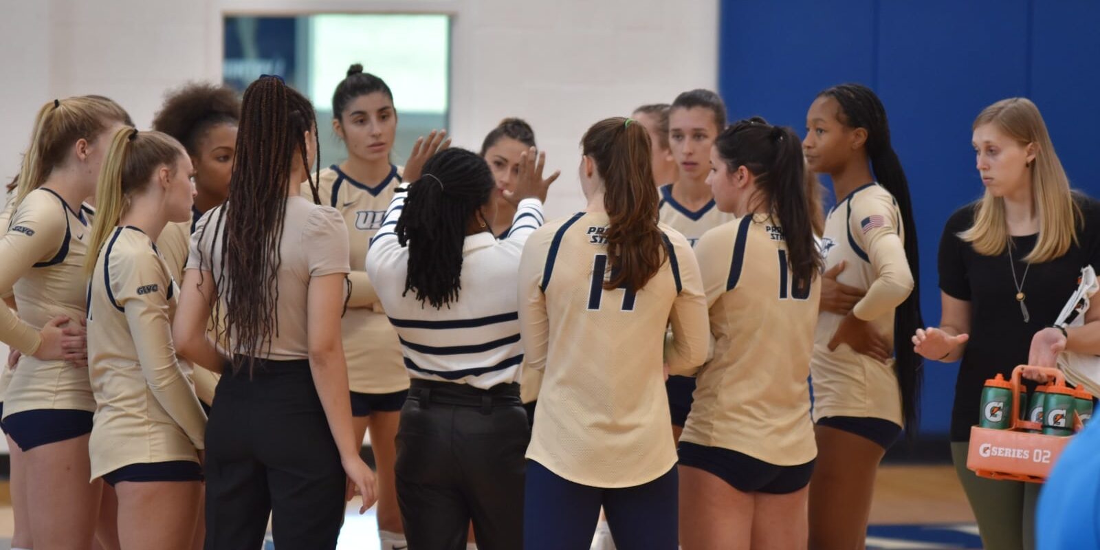 Women's volleyball team huddle