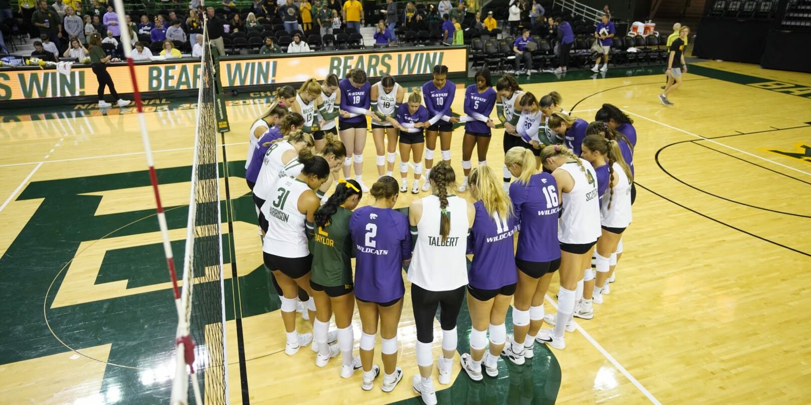 Kansas State vs. Baylor volleyball - teams praying on the court