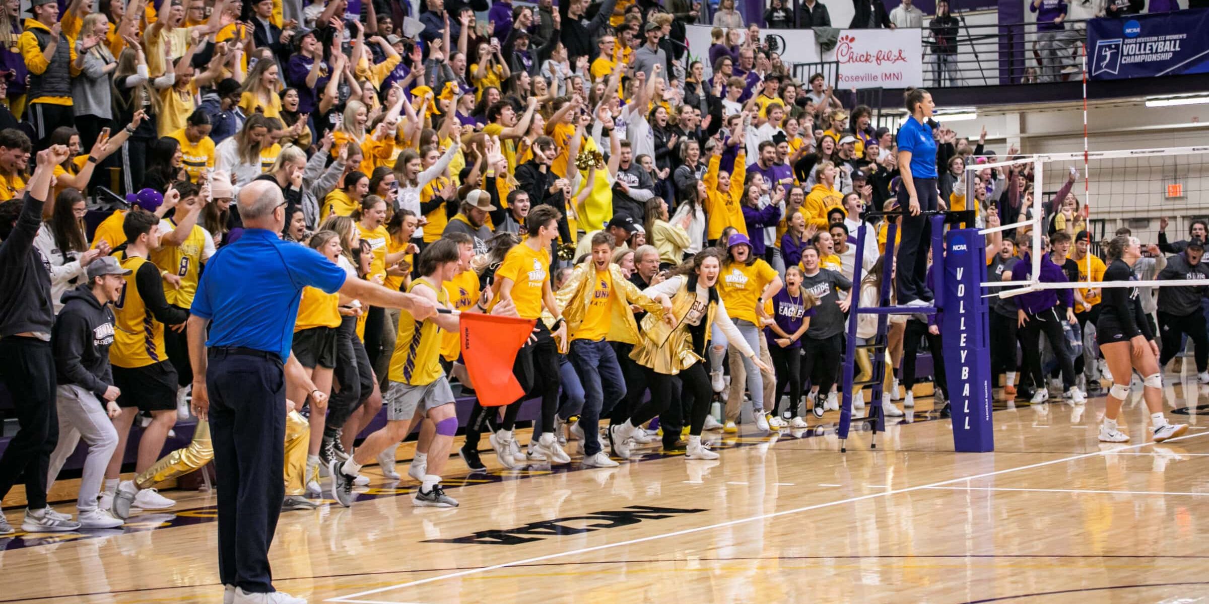 Volleyball fans cheering, volleyball official making a call
