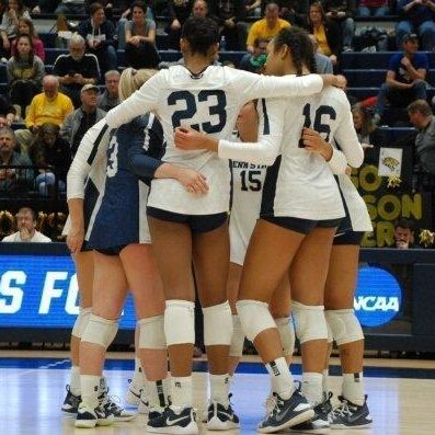 Women's volleyball team huddle